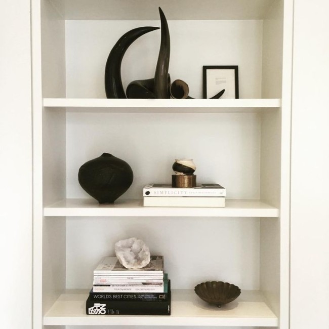 modern design selfie bookshelf styling interior design bethesda md Shelfie with meaning: some purchases but most found or made which is the best! A.bowl my daughter made in ceramics. Black pot made by my sister-in-law (found in her trash-it's one of my favorites). Brass bowl from flea market. Half of a geode I found cleaning out my garage. Framed tiny menu card from trip to Austria for my 40th.
